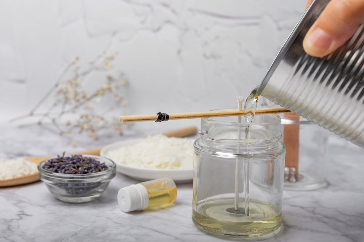 DIY candle making kit with glass jars, soy wax, wicks, and affirmation cards